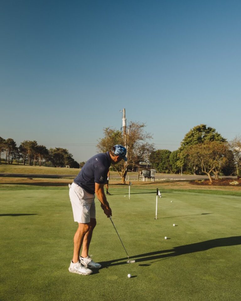 Golfer putting during the ATSG golf outing