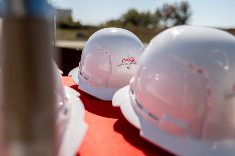 Hard hats at a Coca-Cola groundbreaking ceremony