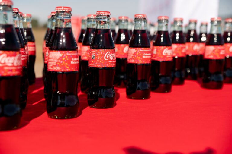 Coca-Cola bottles lined up at a groundbreaking