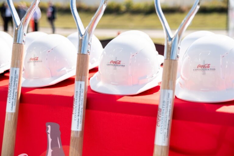 Hard hats and ceremonial shovels at a Coca-Cola groundbreaking