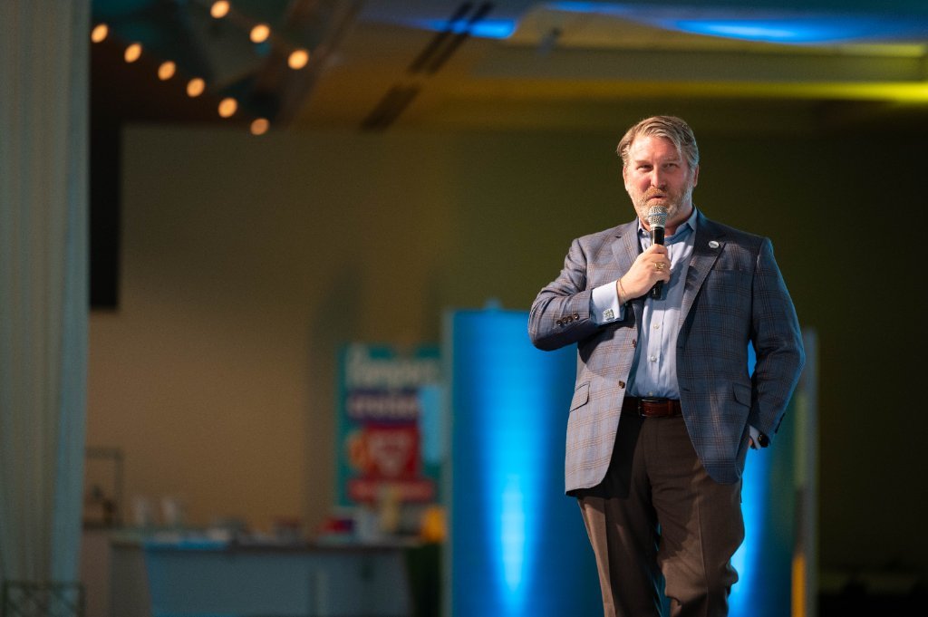 Speaker on stage at a P&G Baby Care event