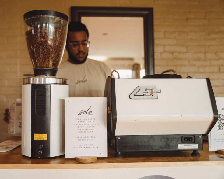 Barista serving coffee at the clubhouse at the ATSG Charity Golf Classic 2025