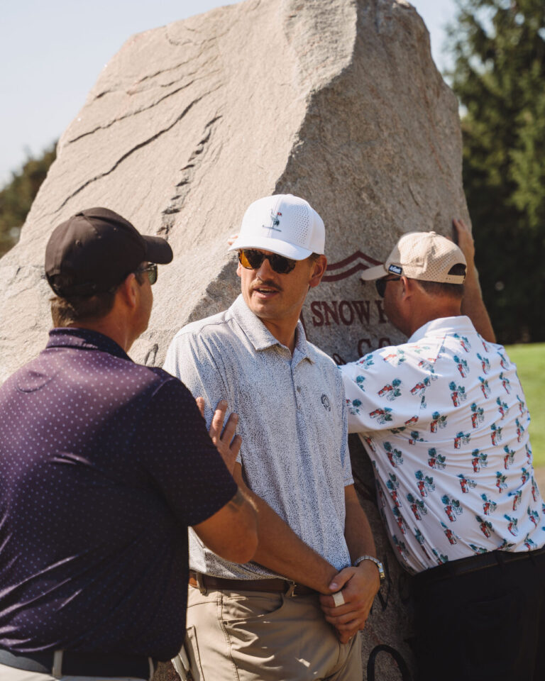 Golfers greeting each other on the course at the ATSG Charity Golf Classic 2025