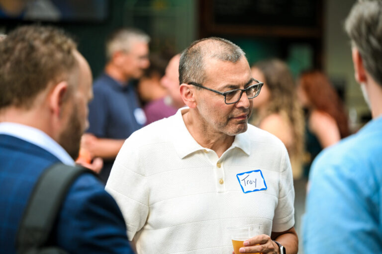 Attendees in conversation at the AWE Symposium reception at Joy District, Chicago