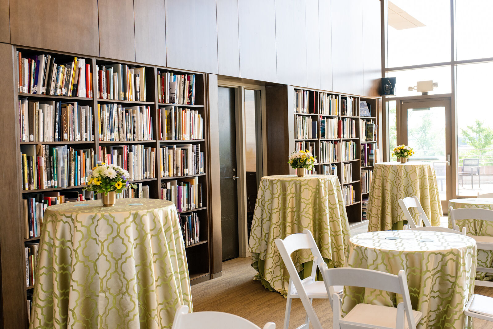 Museum library set with cocktail tables for the berkleyOne reception