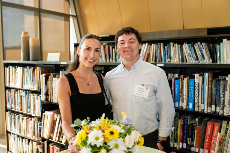 Guests posing in the museum library at the berkleyOne reception