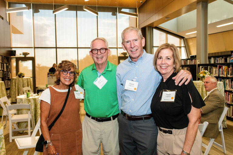 Group of guests posing at the berkleyOne reception