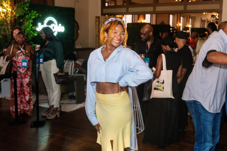 Attendee posing in the event hall at Black Tech Week