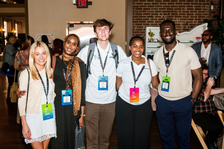 Group of attendees posing at The Backstage Event Center