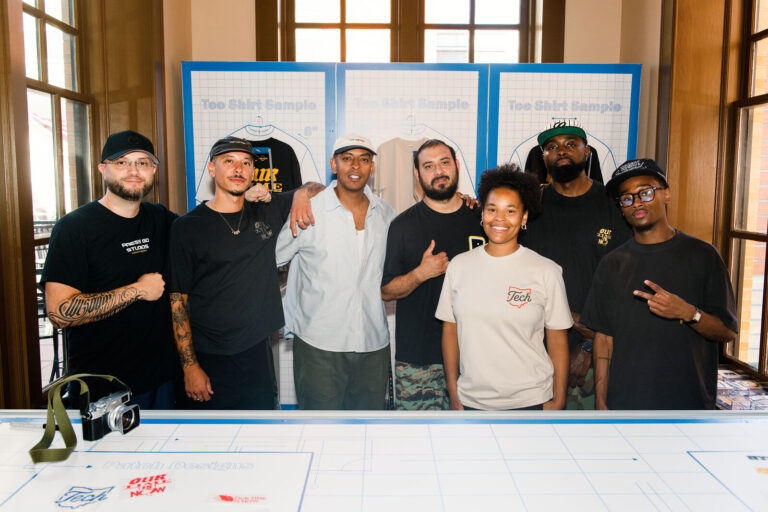 Printing team posing at the T-shirt station at Black Tech Week