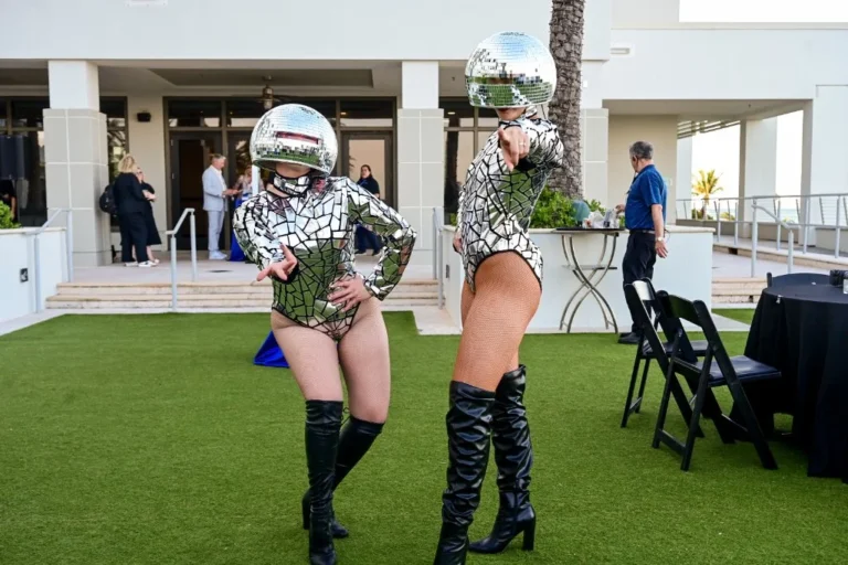 Costumed performers in mirrored helmets entertaining guests at an outdoor brand event – Creative Soul Studios