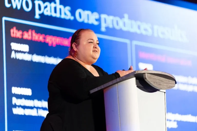 Speaker addressing the audience from a podium – Creative Soul Studios