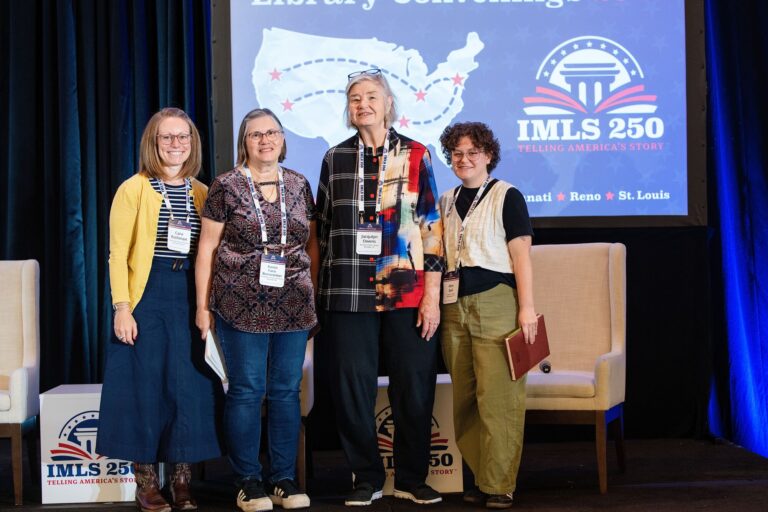 Panelists posing on stage at IMLS Library Convenings St. Louis