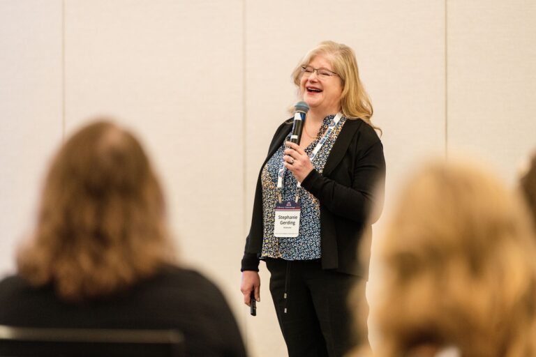 Breakout session presenter speaking with a microphone at IMLS Library Convenings St. Louis