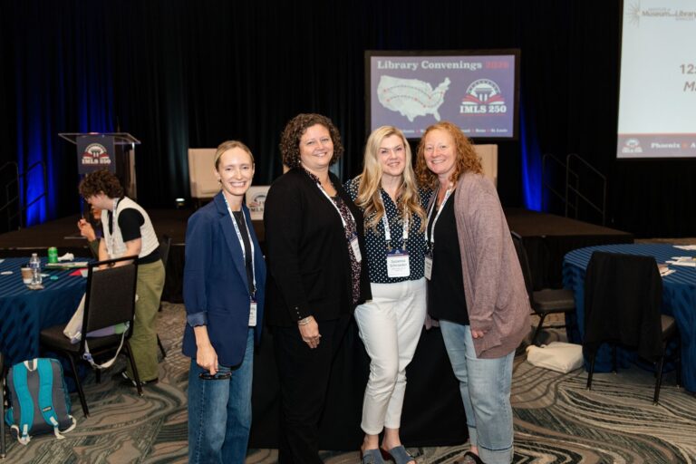 Librarians posing together in the ballroom at IMLS Library Convenings St. Louis