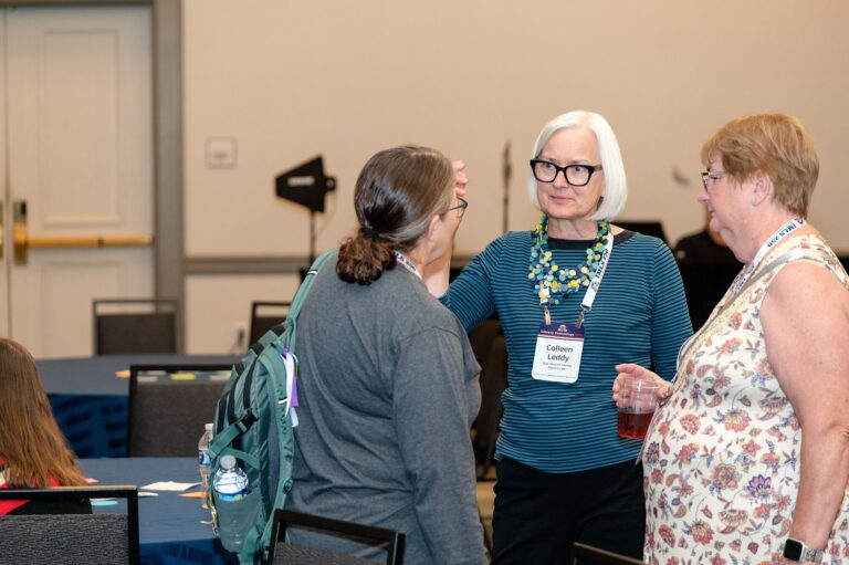 Attendees networking between sessions at the St. Louis Marriott Grand