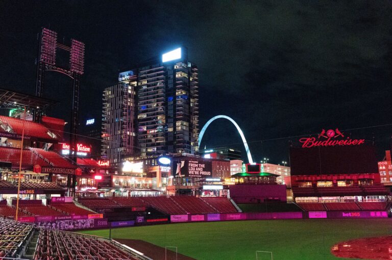 Busch Stadium at night with the Gateway Arch in the skyline