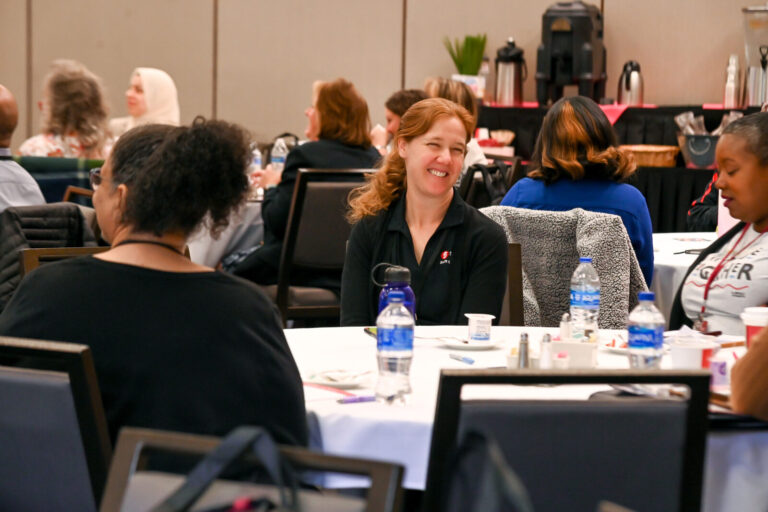 Attendees at round tables during a LeaderShift session
