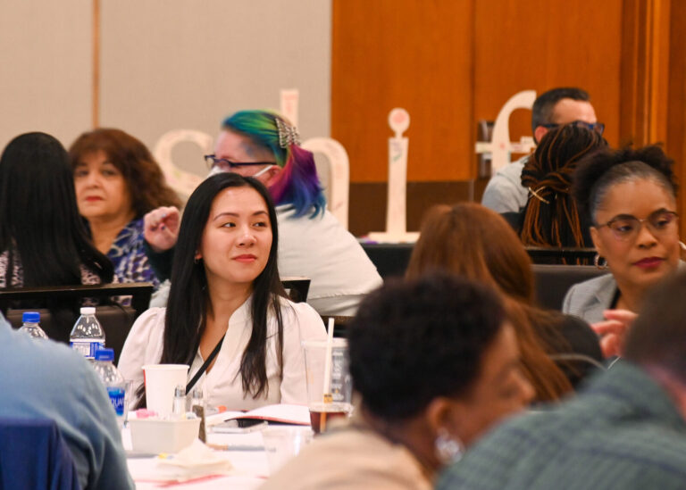 Attendees seated behind the Shift display during LeaderShift