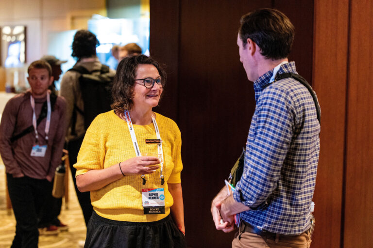 Attendees networking in the Westin Cincinnati pre-function area
