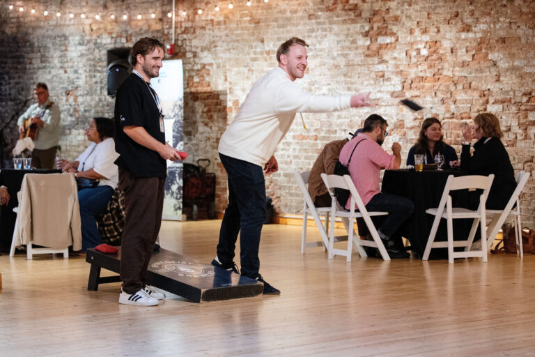 Attendees playing cornhole at the NABSA evening reception