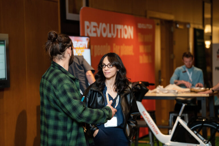 Attendees visiting the Revolution booth at NABSA 2026