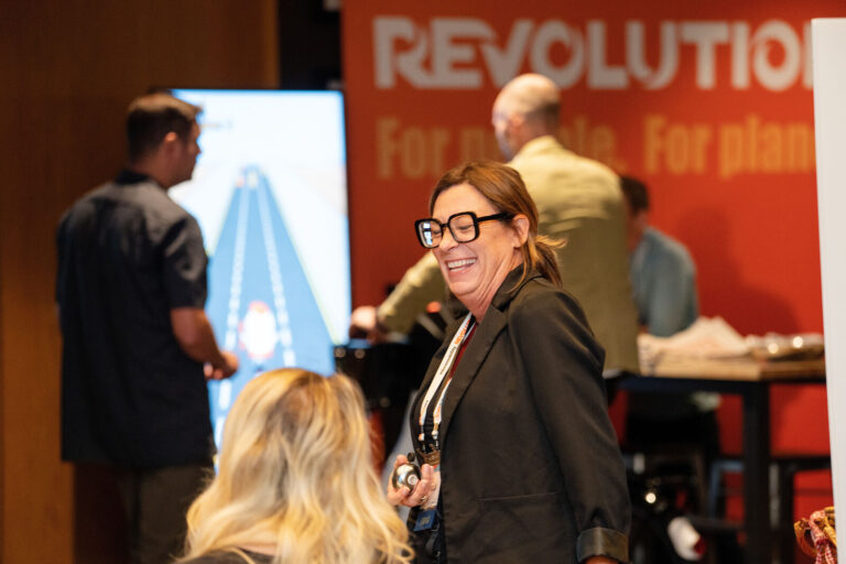 Attendees talking at the Revolution exhibit at The Westin Cincinnati