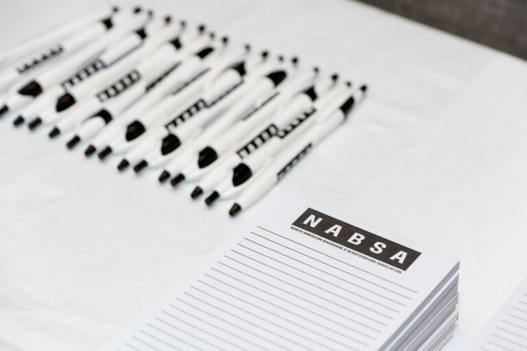 NABSA branded notepads and pens at the conference