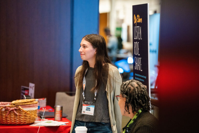 Attendee at an exhibitor table at the NABSA conference