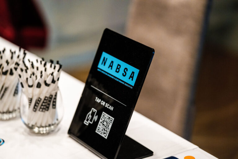 NABSA QR code sign on an exhibitor table