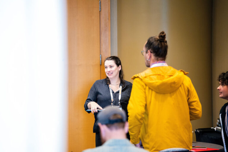 Attendees chatting in a Westin Cincinnati hallway during NABSA