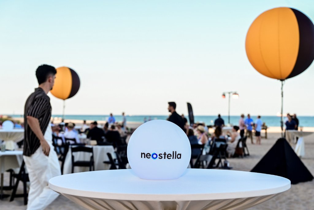 NeoStella logo spheres at an outdoor reception