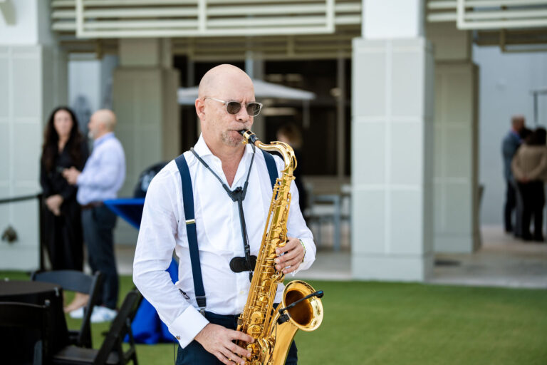 Saxophonist performing at an oceanfront reception at Fort Lauderdale Marriott Harbor Beach
