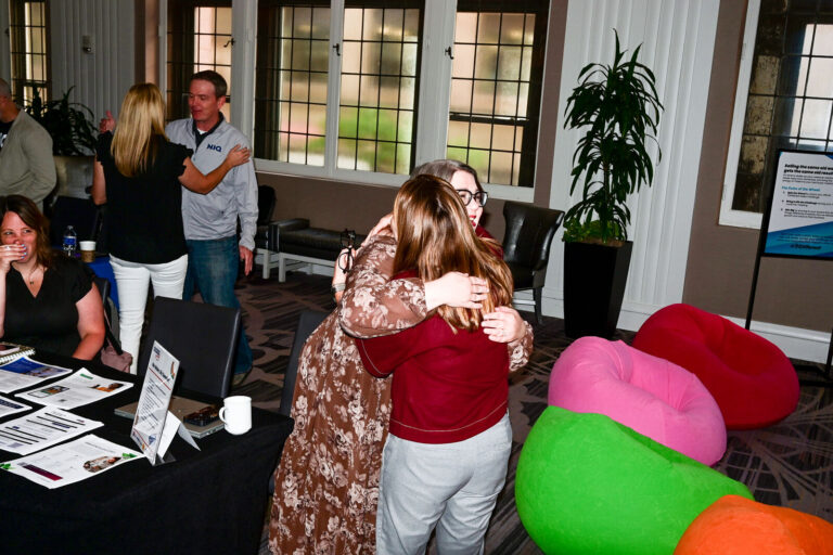 Attendees greeting each other at Renaissance Cincinnati Downtown