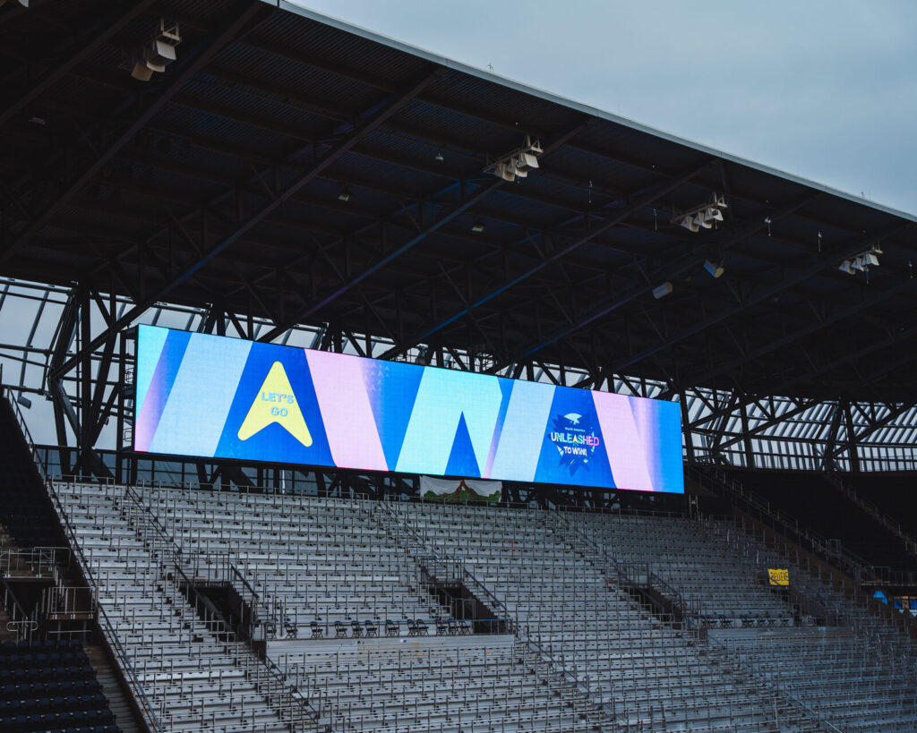 TQL Stadium video board over the seats during a P&G corporate event