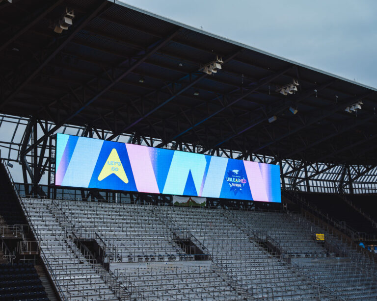 TQL Stadium video board over the seats during a P&G corporate event