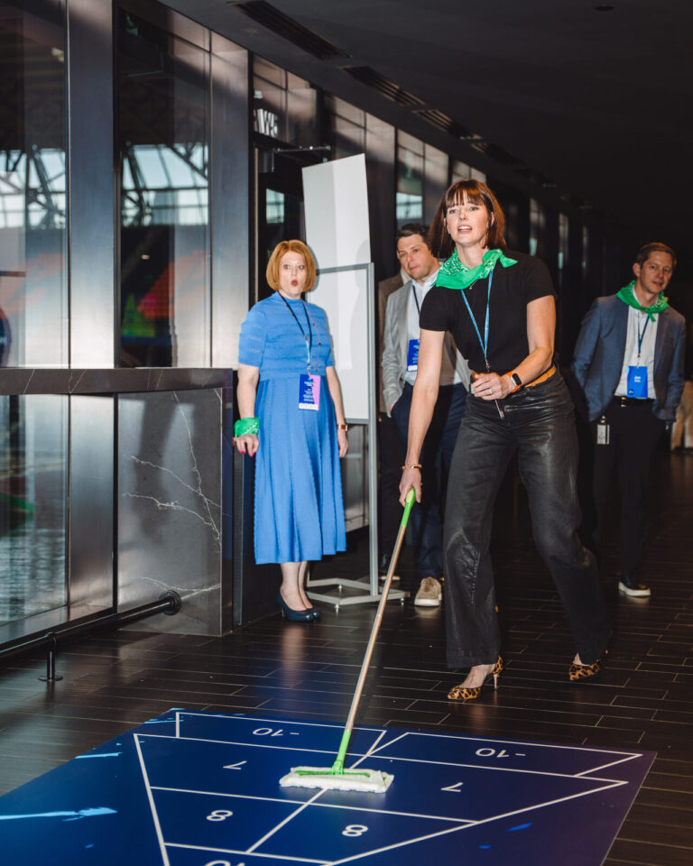 Floor shuffleboard at a P&G team event at TQL Stadium