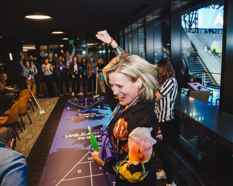Celebrating at a floor game during a P&G event at TQL Stadium