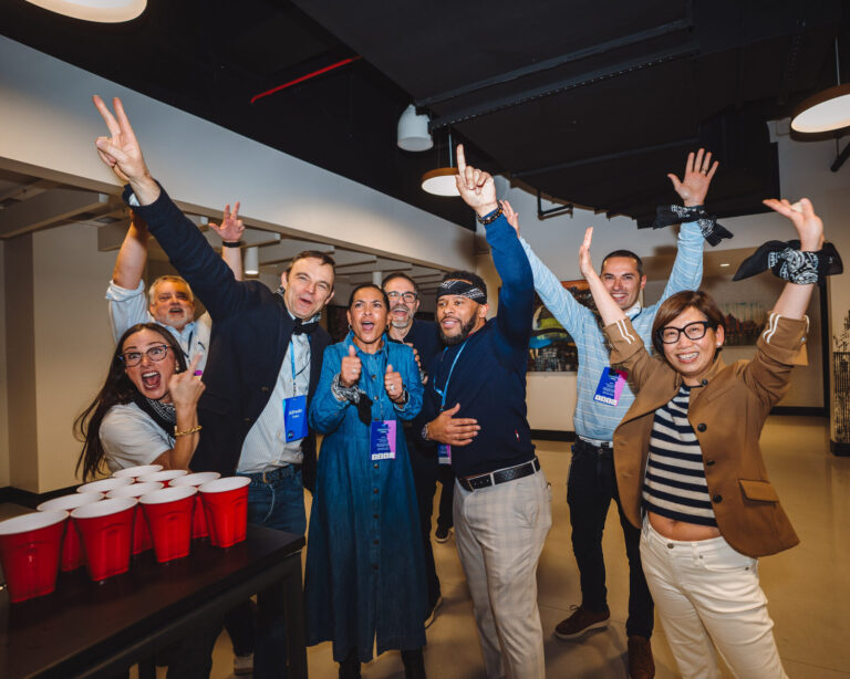 P&G team cheering at a cup game table at TQL Stadium