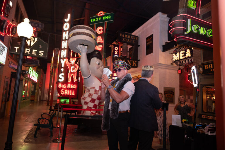Guest in costume by the Big Boy statue at the P&G Baby Care celebration, American Sign Museum Cincinnati