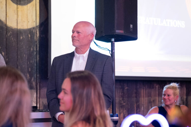 Guest speaking at the front at the P&G Baby Care celebration, American Sign Museum Cincinnati