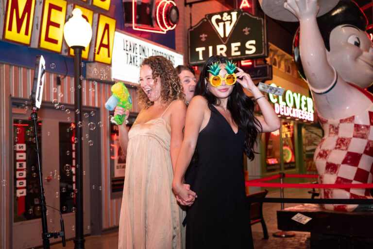 Guests posing by the Big Boy statue at the P&G Baby Care celebration, American Sign Museum Cincinnati