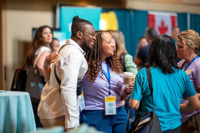 Attendees chatting in the expo at the P&G Baby Care event, Music Hall Cincinnati