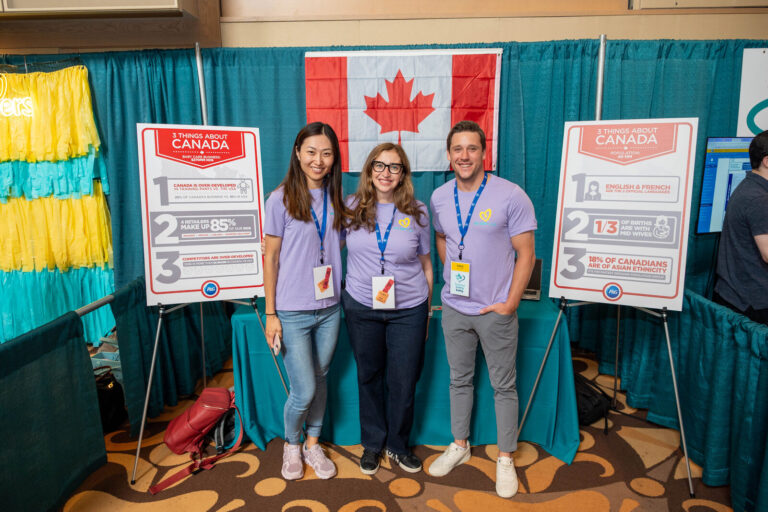 Team posing at the P&G Canada booth at the P&G Baby Care event, Music Hall Cincinnati