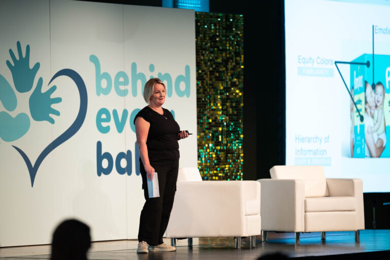 Presenter on the Behind Every Baby stage at the P&G Baby Care event, Music Hall Cincinnati
