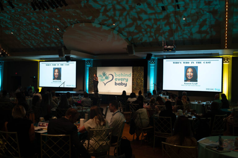 Ballroom audience with stage screens at the P&G Baby Care event, Music Hall Cincinnati