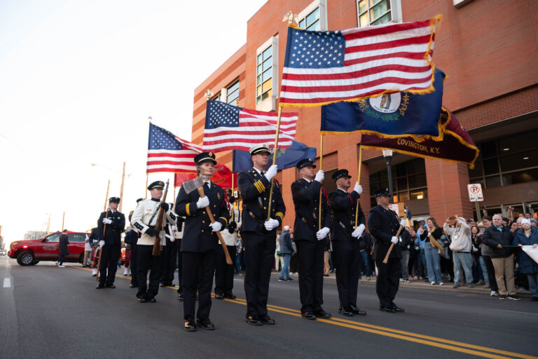 Fire department color guard leading the Walk of Remembrance in Covington, Kentucky