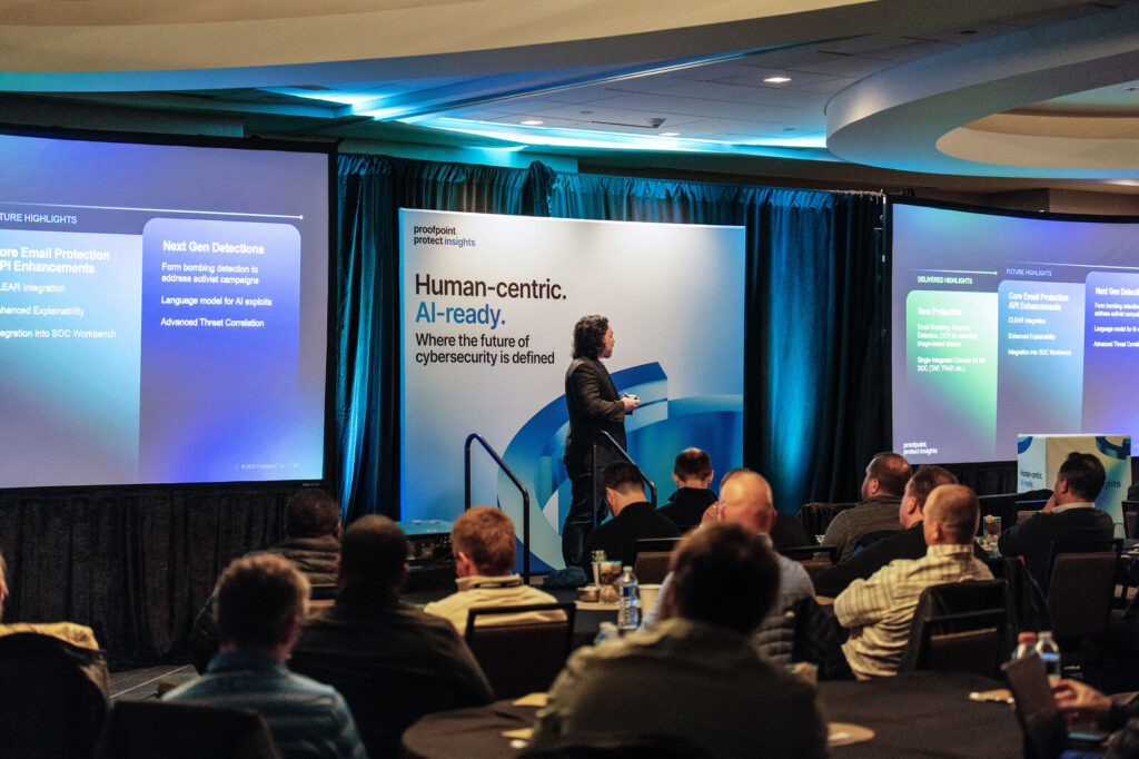 Presenter on stage at Proofpoint Protect Insights in Covington, Kentucky
