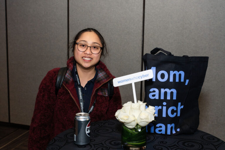 Attendee at the Women in Cyber networking table