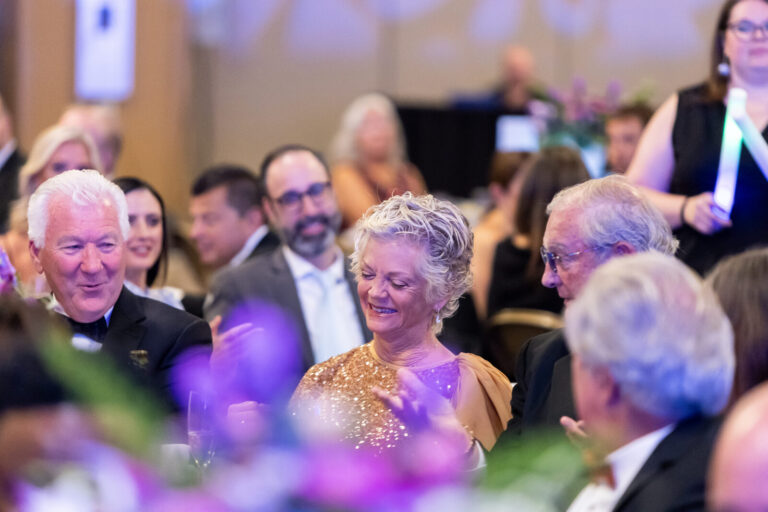 Guests laughing at their table at the Ronald McDonald House Charities gala, Northern Kentucky Convention Center